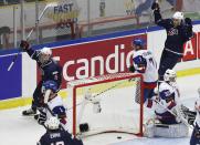 Jack Eichel (L) and Brady Skjei of the U.S. celebrate after scoring a goal against Slovakia's goalie Richard Sabol and Jakub Predajniansky (2R) during the first period of their IIHF World Junior Championship ice hockey game in Malmo, Sweden, December 28, 2013. REUTERS/Alexander Demianchuk (SWEDEN - Tags: SPORT ICE HOCKEY)