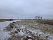 In this Dec. 27, 2019, photo, "Monument Hill" is shown at the Sand Creek Massacre National Historic Site in Eads, Colo. This quiet piece of land tucked away in rural southeastern Colorado seeks to honor the 230 peaceful Cheyenne and Arapaho tribe members who were slaughtered by the U.S. Army in 1864. It was one of worst mass murders in U.S. history. (AP Photo/Russell Contreras)