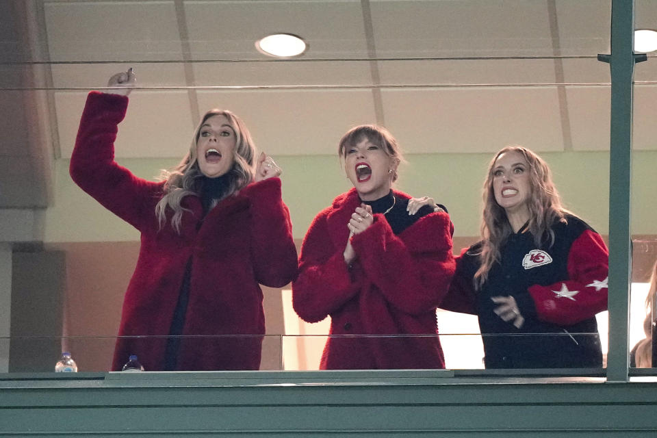 Taylor Swift, center, cheers during the second half of an NFL football game between the Kansas City Chiefs and Green Bay Packers, Sunday, Dec. 3, 2023 in Green Bay, Wis. (AP Photo/Morry Gash)