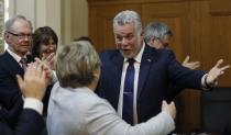 Liberal leader Philippe Couillard greets party members after Quebec's Premier Pauline Marois called an election at the National Assembly in Quebec City, March 5, 2014. Quebec voters will head to the poll for a provincial election on April 7. REUTERS/Mathieu Belanger (CANADA - Tags: POLITICS ELECTIONS)