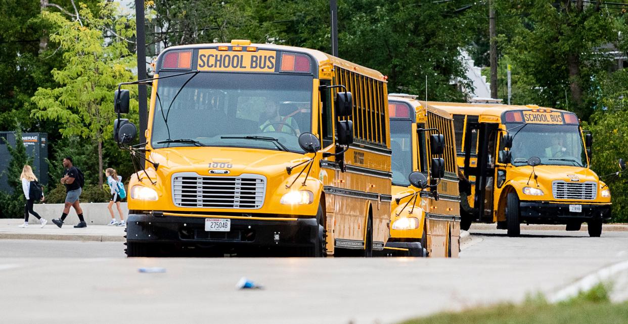 School buses arrive Sept. 7 at Butler Middle School in Waukesha -- after school starts. A bus driver shortage means some Waukesha students aren't even picked up until after school starts.