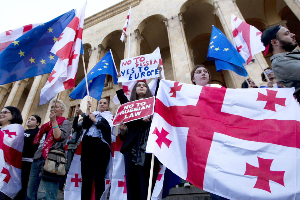 Protestors gather outside the parliament building in Tbilisi, Georgia, on Monday, April 15, 2024, to protest against the "the Russian law" similar to a law that Russia uses to stigmatize independent news media and organizations seen as being at odds with the Kremlin. (AP Photo/Shakh Aivazov)