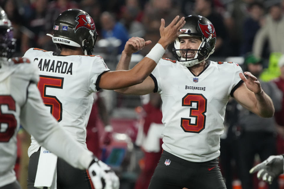Tampa Bay Buccaneers place kicker Ryan Succop (3) celebrates his game-winning field goal against the Arizona Cardinals with punter Jake Camarda (5) during the second half of an NFL football game, Sunday, Dec. 25, 2022, in Glendale, Ariz. The Buccaneers defeated the Cardinals 19-16 in overtime. (AP Photo/Rick Scuteri)