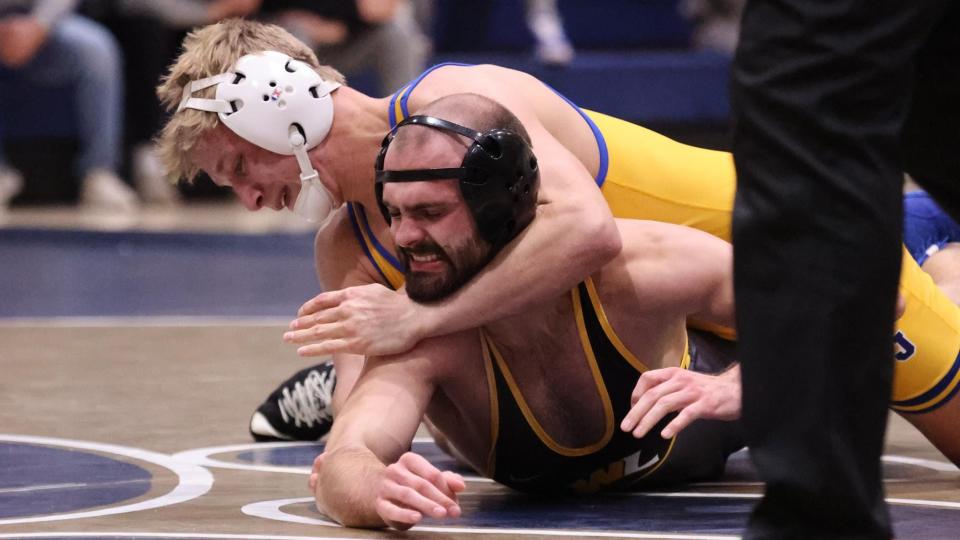 Pitt-Johnstown's Jacob Ealy, a former state champion at Hopewell, gains control of an opponent during a match this season.