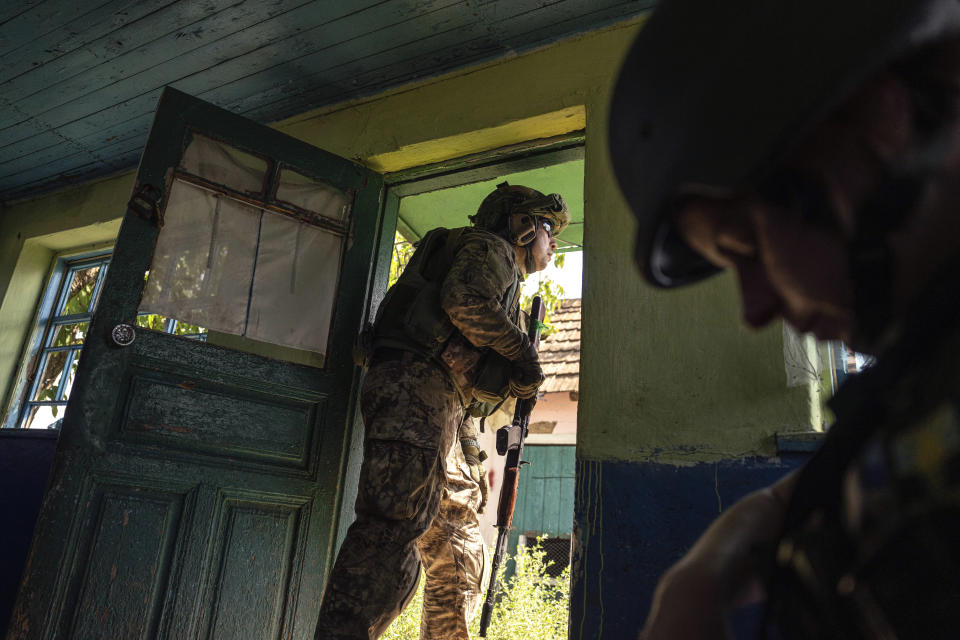 A Ukrainian serviceman of "Fireflies" reconnaissance team guards at his position at the frontline in Mykolaiv region, Ukraine, on Monday, Aug. 8, 2022. (AP Photo/Evgeniy Maloletka)