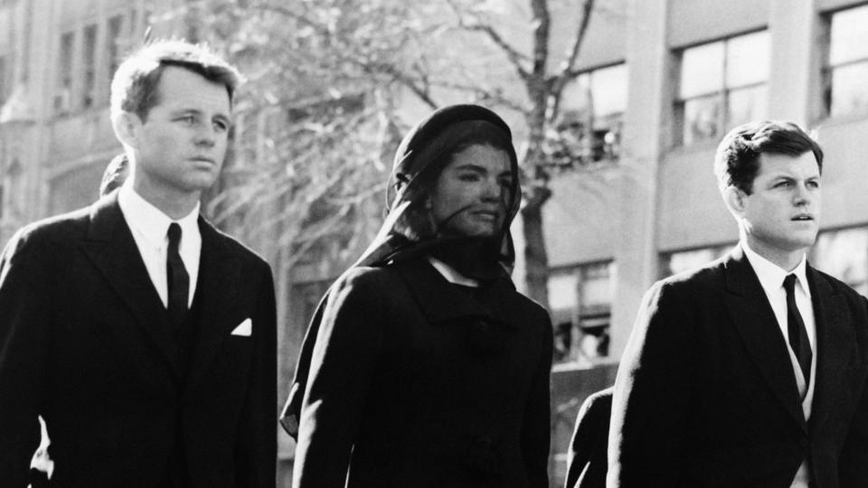 <p>Here, Jackie walks in her husband's funeral procession alongside her brothers-in-law, Bobby and Ted Kennedy. </p>