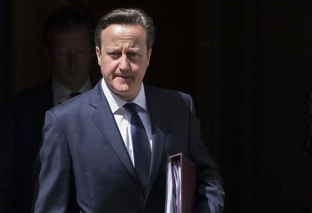 Britain's Prime Minister David Cameron leaves Number 10 Downing Street to speak at Parliament in London, Britain June 29, 2015. REUTERS/Neil Hall