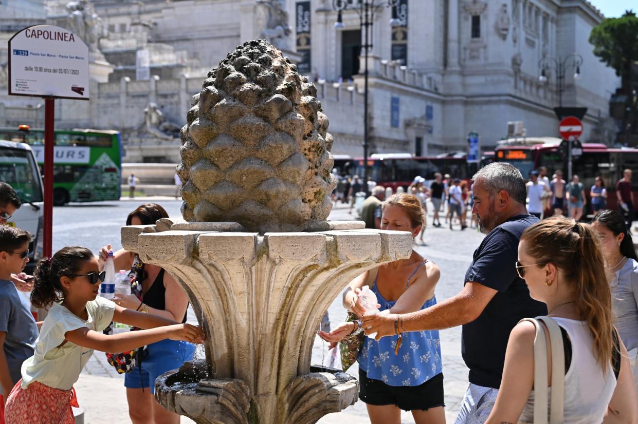 Visitors fill their bottles with water at a fountain in Rome, Italy (AFP via Getty Images)