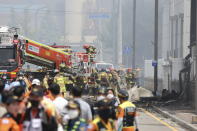 Firefighters work at the site of a burnt lithium battery manufacturing factory in Hwaseong, South Korea, Monday. June 24, 2024. (Hong Ki-wonj/Yonhap via AP)