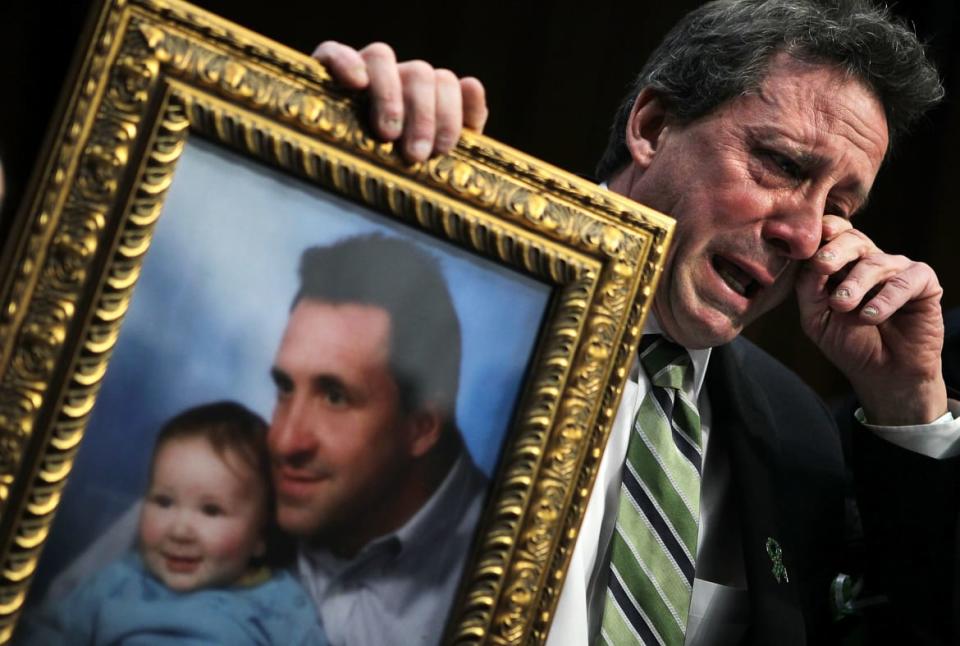 <div class="inline-image__caption"><p>Neil Heslin, father of six-year-old Sandy Hook Elementary School shooting victim Jesse Lewis, wipes tears as he testifies during a hearing before the Senate Judiciary Committee February 27, 2013 on Capitol Hill in Washington, DC. The committee held a hearing on "The Assault Weapons Ban of 2013.</p></div> <div class="inline-image__credit">Alex Wong/Getty</div>