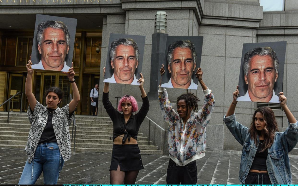 Protesters outside the New York courtroom where Jeffrey Epstein was charged, in July. He died a month after he was arrested. - Getty Images