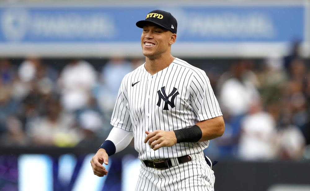 New York Yankees center fielder Aaron Judge warms up before a baseball game against the Tampa Bay Rays on Sunday, Sept. 11, 2022, in New York. (AP Photo/Noah K. Murray)