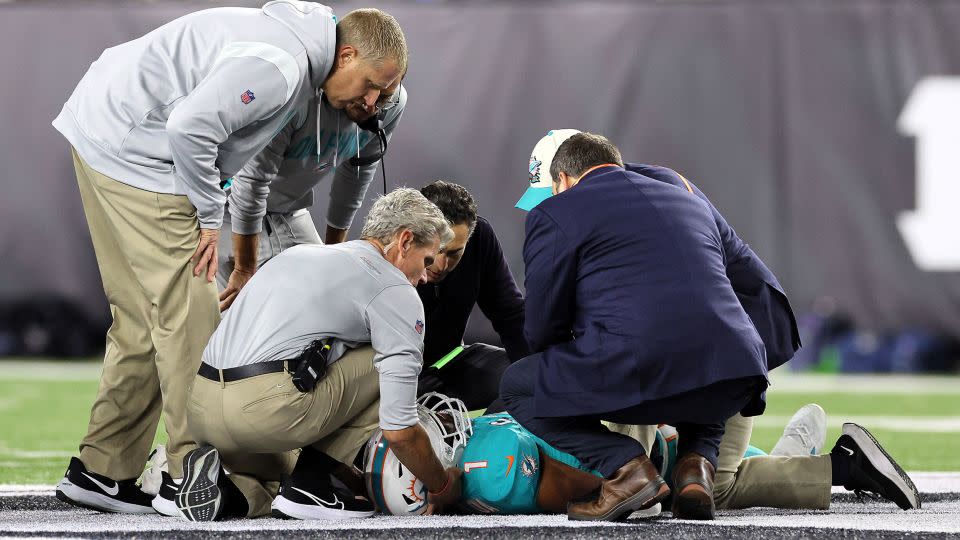 Medical staff tend to Miam Dolphins quarterback Tua Tagovailoa after he took a hit during a September 29 game against the Cincinnati Bengals. - Andy Lyons/Getty Images