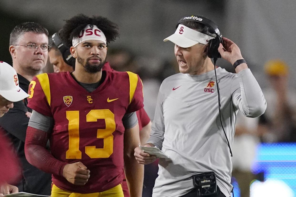 USC quarterback Caleb Williams, left, talks coach Lincoln Riley during a win over Arizona State.