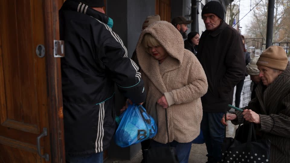 An aid distribution point in Kherson city. Some days there aren't enough packages for everyone in line. - Christian Streib/CNN