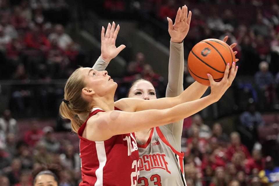 Nebraska forward Natalie Potts (22) shoots in front of Ohio State forward Rebeka Mikulasikova during the first half of an NCAA college basketball game Wednesday, Feb. 14, 2024, in Columbus, Ohio. (AP Photo/Sue Ogrocki)