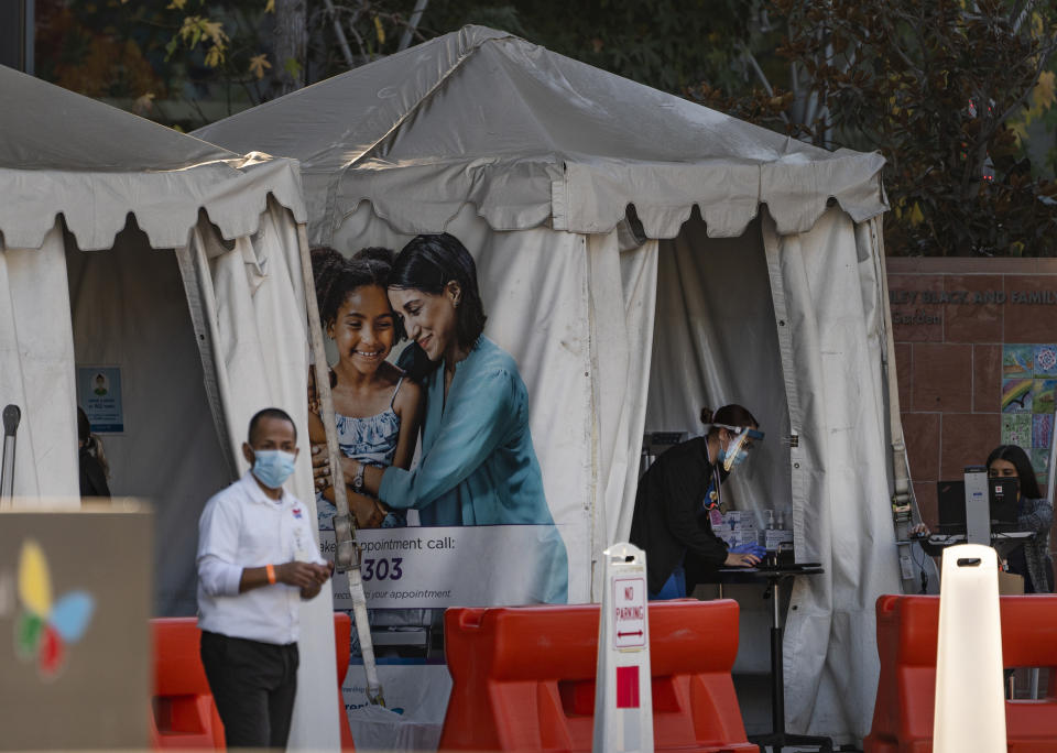 FILE - In this Dec. 18, 2020, file photo, medical tents for vaccinations are set outside the Children's Hospital Los Angeles. California became the first state to record 2 million confirmed coronavirus cases, reaching the milestone on Christmas Eve as close to the entire state was under a strict stay-at-home order and hospitals were flooded with the largest crush of cases since the pandemic began. (AP Photo/Damian Dovarganes, File)