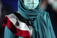 Team member of Iran walks during the opening ceremony inside the Olympic Stadium at the 2020 Summer Olympics, Friday, July 23, 2021, in Tokyo, Japan. (AP Photo/Petr David Josek)