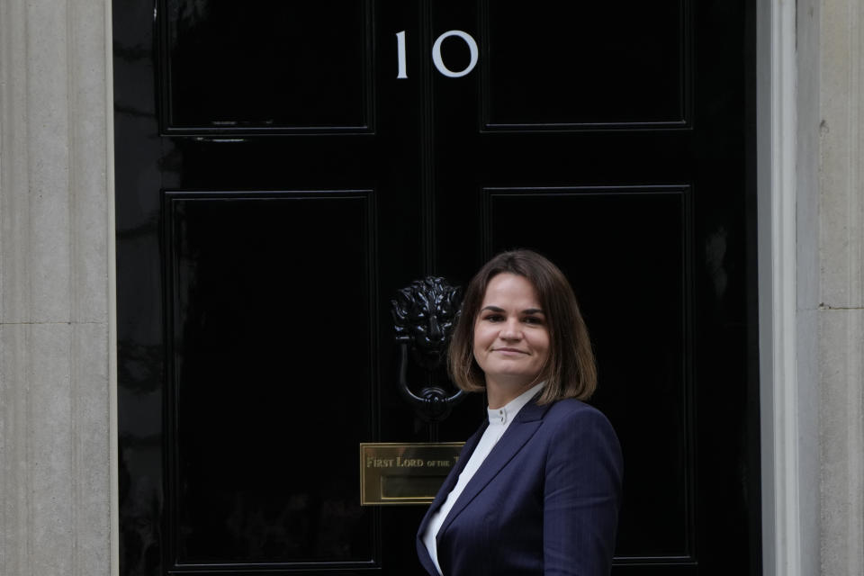 Belarus opposition leader Sviatlana Tsikhanouskaya poses for the media on the doorstep of 10 Downing Street before a meeting with the British Prime Minister Boris Johnson in London, Tuesday, Aug. 3, 2021. (AP Photo/Alastair Grant)