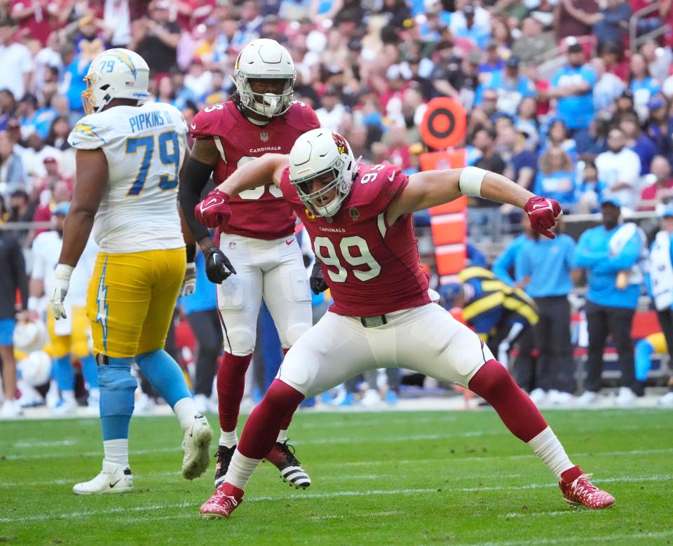 Nov 27, 2022; Glendale, AZ, USA;  Arizona Cardinals defensive end J.J. Watt (99) celebrates a sack against the Los Angeles Chargers during the first quarter at State Farm Stadium.