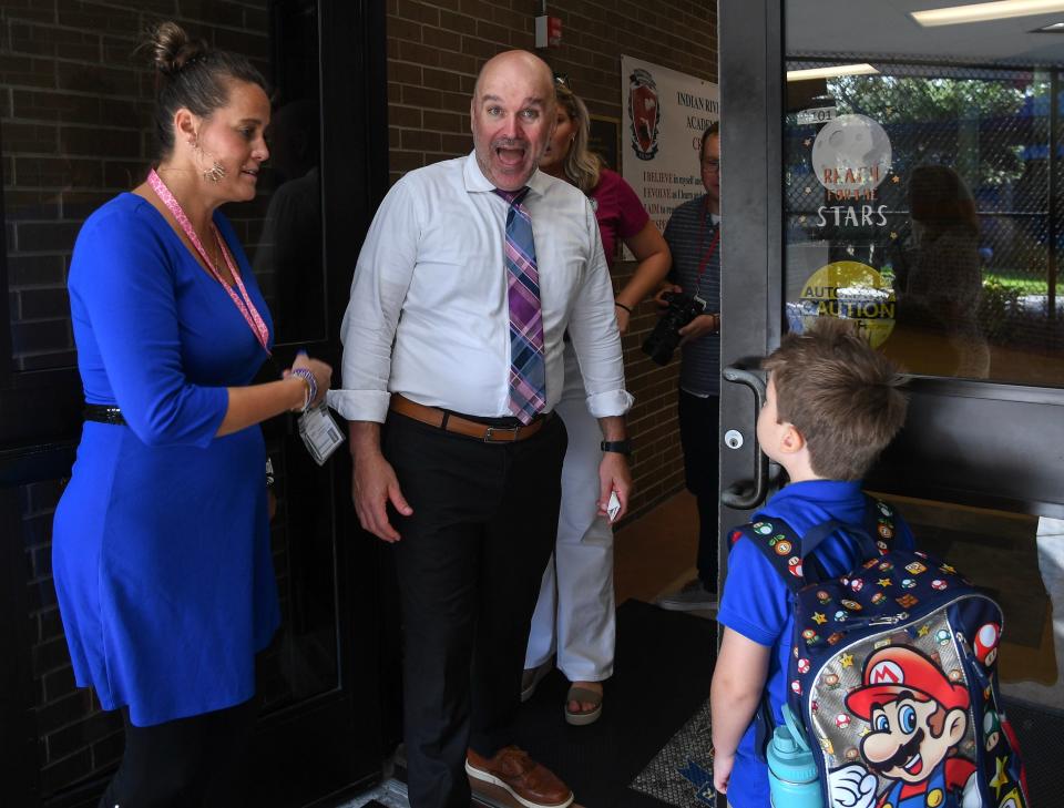 Students at Indian River Academy are greeted by teachers, first-year principal Kimberly Rahal and Indian River County Superintendent David Moore, as parents say their tearful goodbyes, Thursday, Aug. 10, 2023, in Vero Beach.