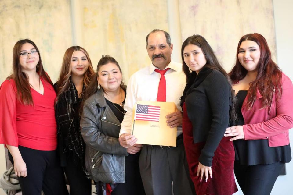 Gonzalo Barriga (center) with his family after being sworn in as U.S. citizen Wednesday (Dec. 20) afternoon at the U.S. Citizenship and Immigration Services Fresno field office.