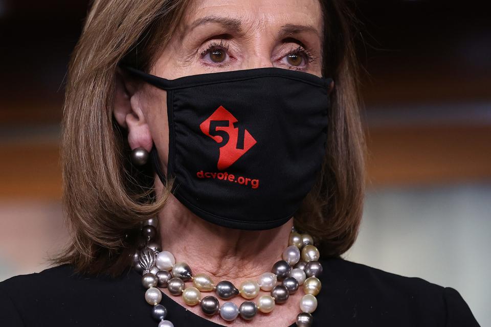 House Speaker Nancy Pelosi wears  a '51' face mask during a news conference about statehood for the District of Columbia at the U.S. Capitol on April 21.