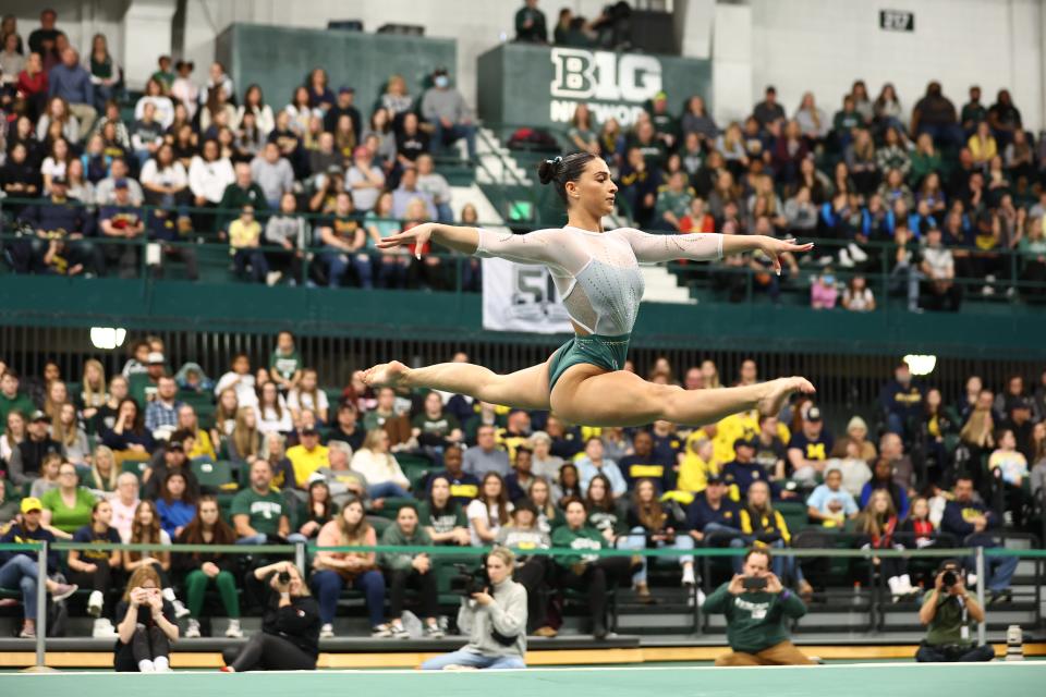 Delanie Harkness performs the floor exercise during the Spartans' win over Michigan earlier this season.