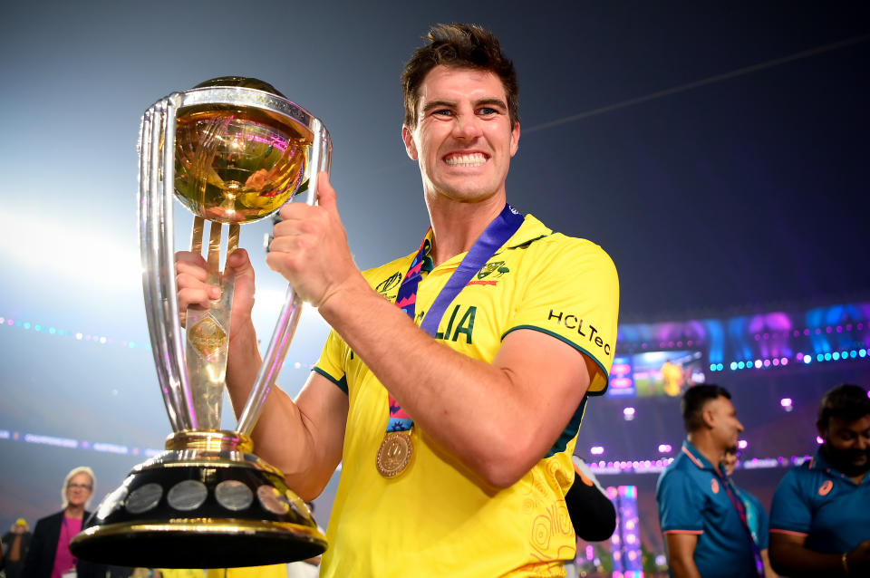 AHMEDABAD, INDIA - NOVEMBER 19: Pat Cummins of Australia poses with the ICC Mens Cricket World Cup Trophy after victory in  the ICC Men's Cricket World Cup India 2023 Final between India and Australia at Narendra Modi Stadium on November 19, 2023 in Ahmedabad, India. (Photo by Alex Davidson-ICC/ICC via Getty Images)