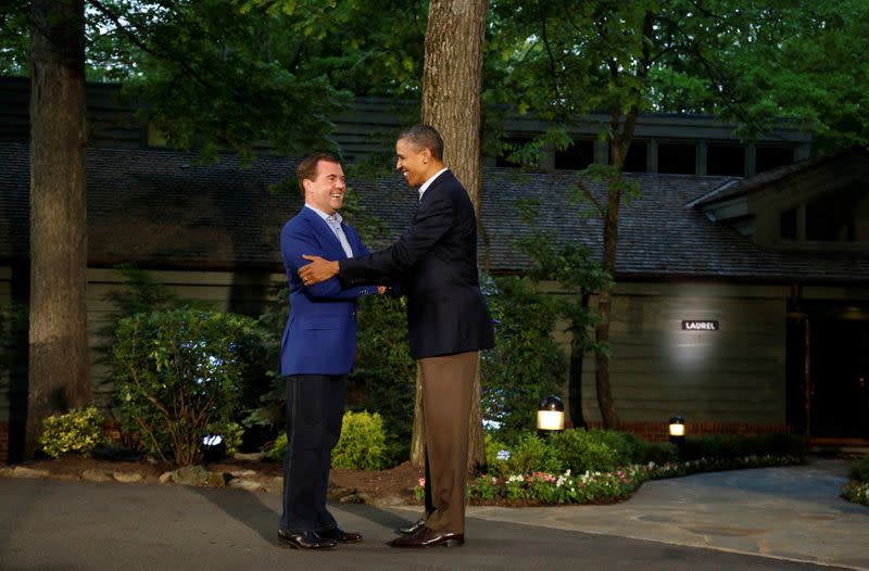 FILE PHOTO: U.S. President Obama greets Russia's Prime Minister Medvedev as he arrives at the G8 Summit at Camp David