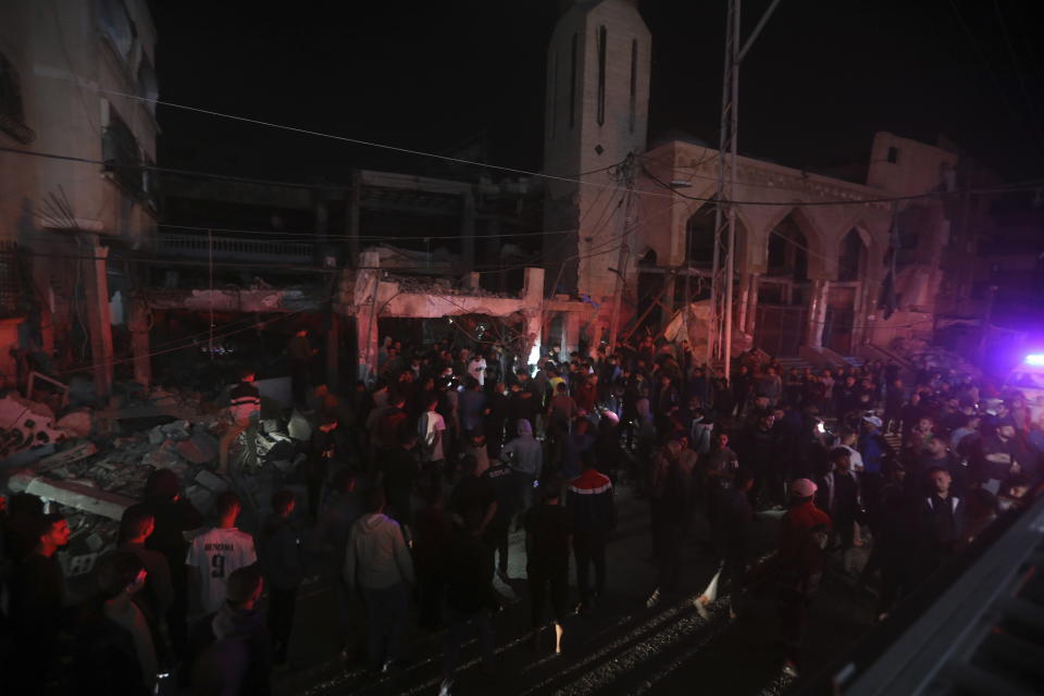 Palestinians inspect the rubble of destroyed a residential building of the Abo al Hanood family after an Israeli airstrike in Rafah refugee camp, southern Gaza Strip, Wednesday, April 17, 2024. (AP Photo/Ismael Abu Dayyah)