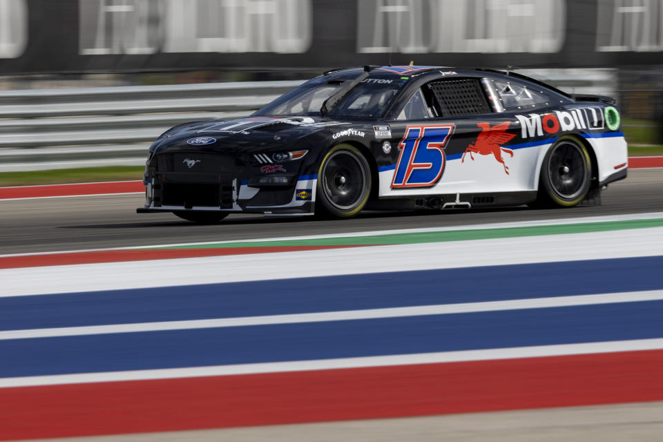 Jenson Button steers his car through Turn 17 during qualifying qualifying for the NASCAR Cup Series auto race at Circuit of the Americas, Saturday, March 25, 2023, in Austin, Texas. (AP Photo/Stephen Spillman)