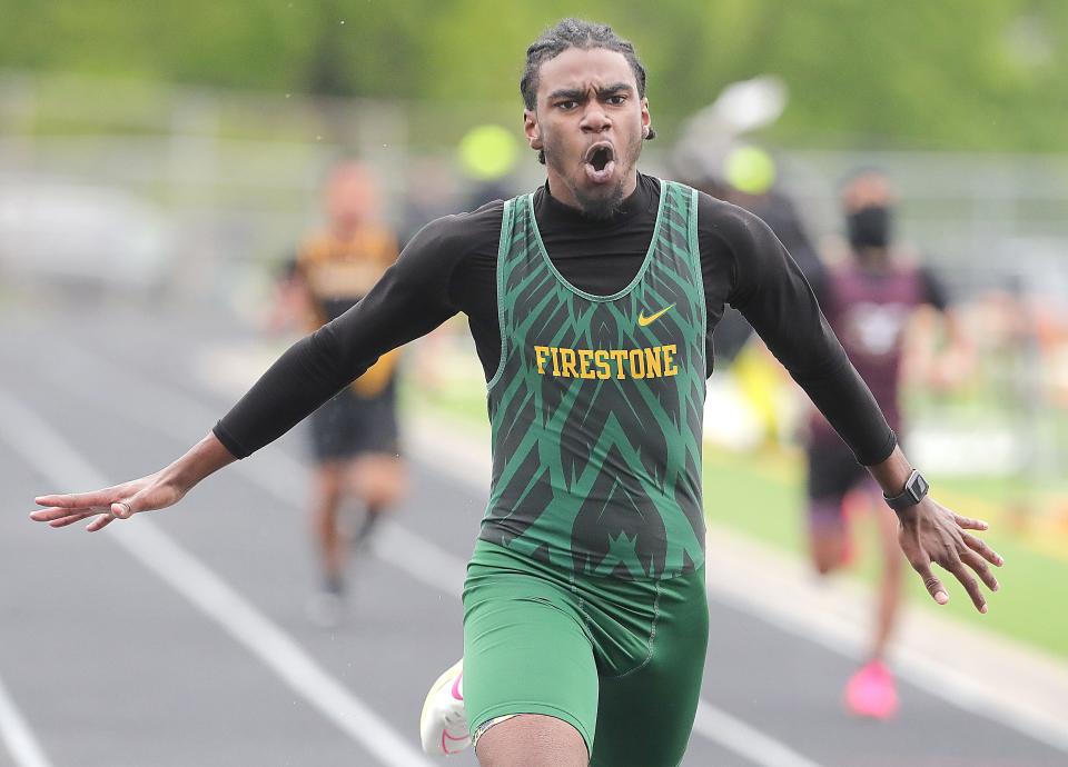 Johnathan White of Firestone reacts after winning the 200 meters in the City Series track and field championship meet, Saturday, May 11, 2024, at Ellet High School.