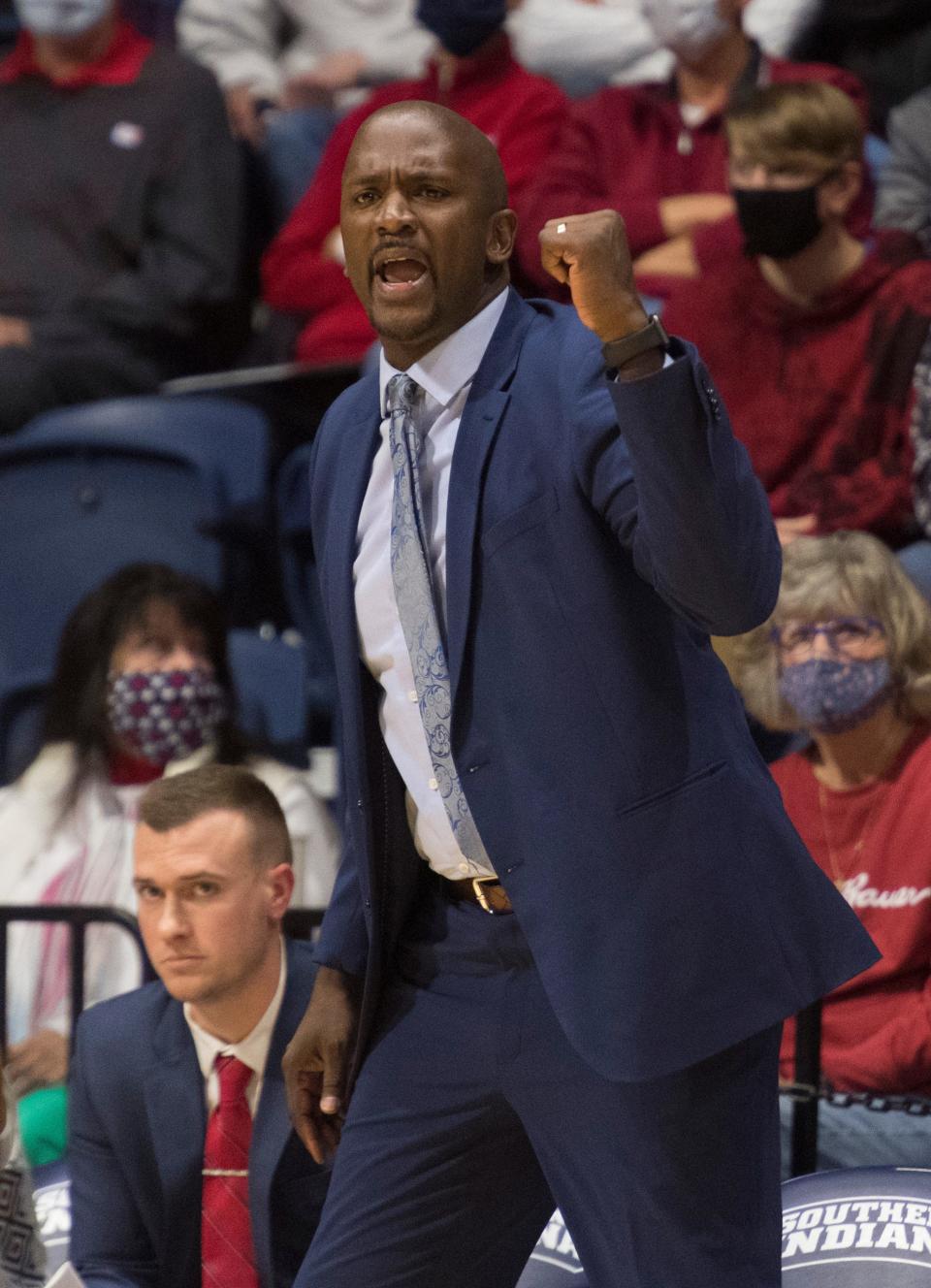 Southern Indiana Head Coach Stan Gouard cheers for his team as the University of Southern Indiana Screaming Eagles play the Southwest Baptist University Bearcats at Screaming Eagles Arena in Evansville, Ind., Saturday afternoon, Jan. 8, 2022. 