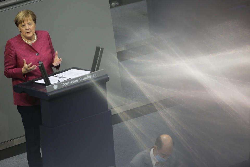 German Chancellor Angela Merkel delivers her speech during a debate about her policy as part of Germany's budget 2021 debate at the parliament Bundestag in Berlin, Germany, Wednesday, Sept. 30, 2020. (AP Photo/Markus Schreiber)