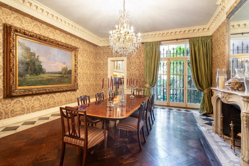 On the parlor floor is an elaborate formal dining room with a butler’s pantry and a deck to one side and a living room to the other.