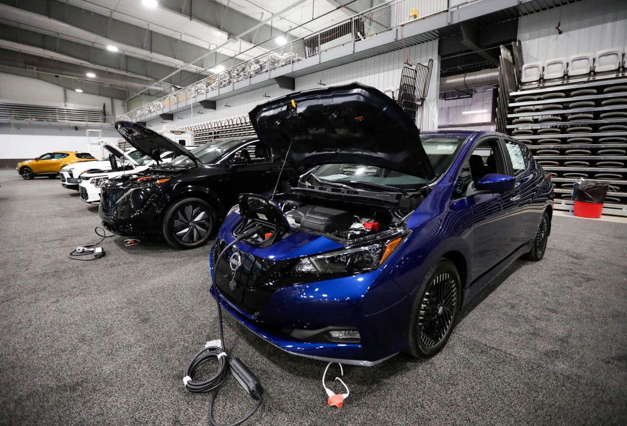 Electric vehicles at during setup for the first Springfield Auto Show at the Wilson Logistics Arena at the Ozark Empire Fairgrounds on Thursday, Nov. 2, 2023.