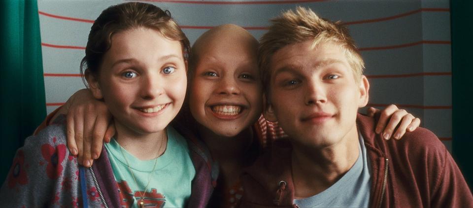 Anna (Abigail Breslin), from left, Kate (Sofia Vassilieva) and Jesse (Evan Ellingson) pose inside a photo booth in a scene from "My Sister’s Keeper."