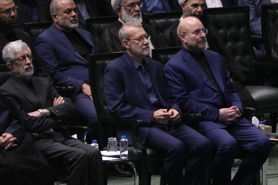 Mohammad Bagher Qalibaf, right, attends the opening ceremony of the new parliament term in Tehran, Iran, Monday, May 27, 2024. Iran's parliament re-elected hard-liner Qalibaf on Tuesday as its speaker, reaffirming its hard-right makeup in the wake of a helicopter crash that killed the country's president and foreign minister. (AP Photo/Vahid Salemi)