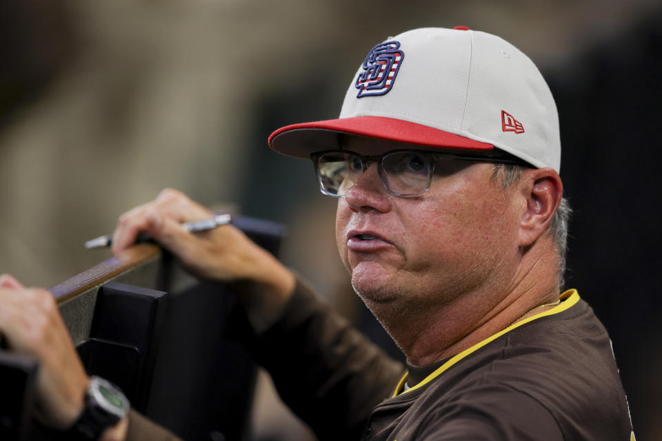 San Diego Padres manager Mike Shildt speaks to his team in the dugout during the sixth inning baseball game against the Texas Rangers, Thursday, July 4, 2024, in Arlington, Texas. (AP Photo/Gareth Patterson)