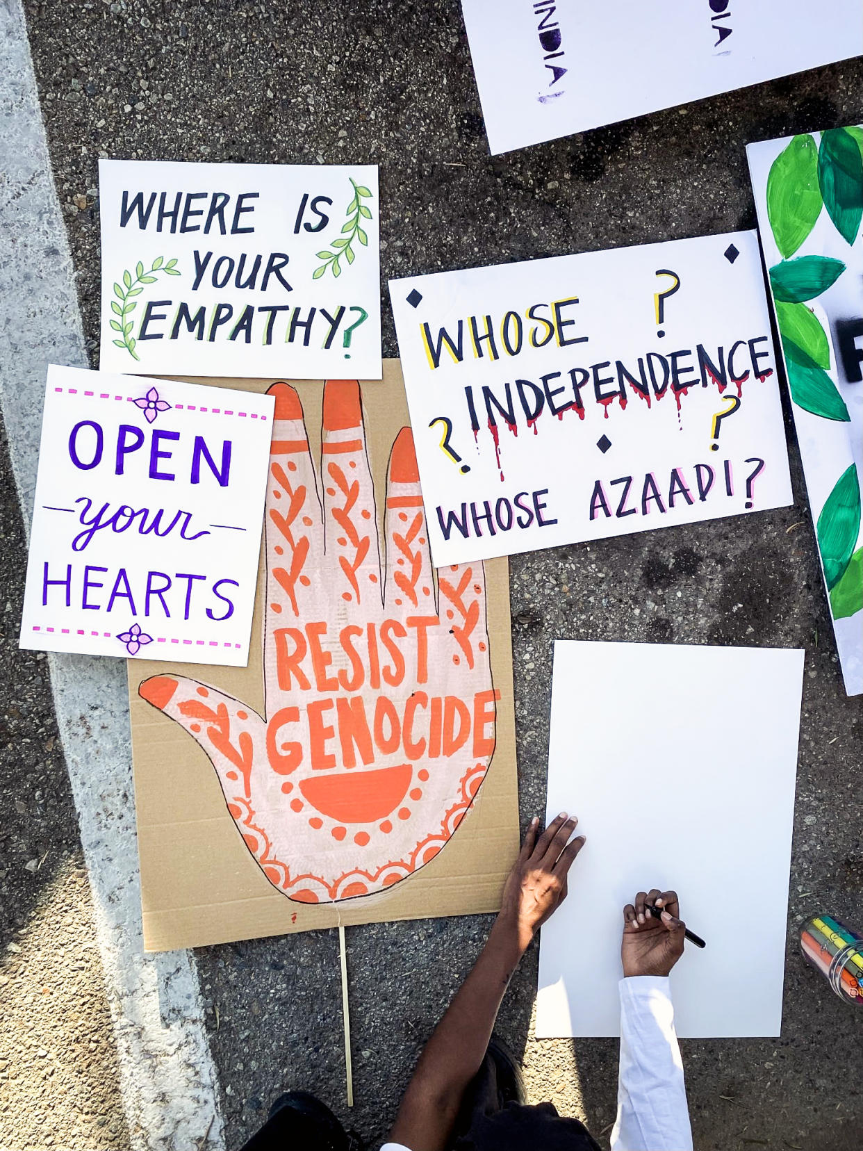 Signs brought by protestors at the Indian Independence Day parade in Anaheim, Cali on Sunday. (Shanelle Gulabi)