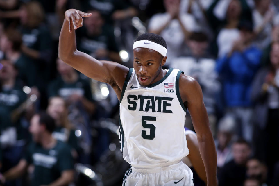 Michigan State's Tre Holloman reacts after hitting a 3-pointer against Alcorn State during the first half of an NCAA college basketball game, Sunday, Nov. 19, 2023, in East Lansing, Mich. (AP Photo/Al Goldis)