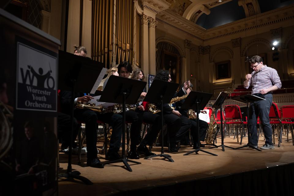 Dan Gabel, Director of the Worcester Youth Jazz Program, talks to children during a dress rehearsal May 7 at Mechanics Hall.