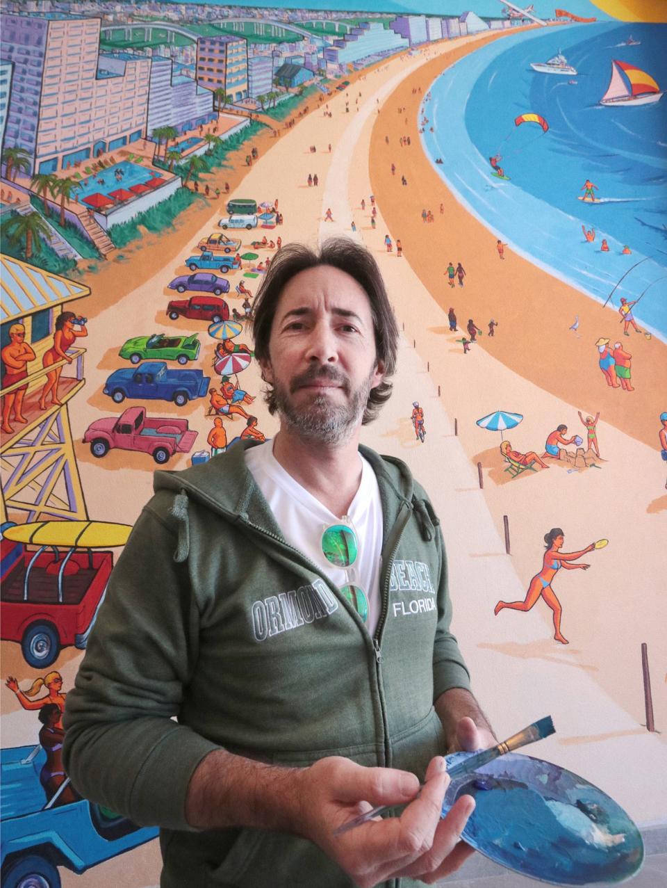 Artist Erwin Dazelle and his Daytona Beach themed mural, Tuesday November 16, 2021 on a wall of the Dayona Hotel at One Daytona.