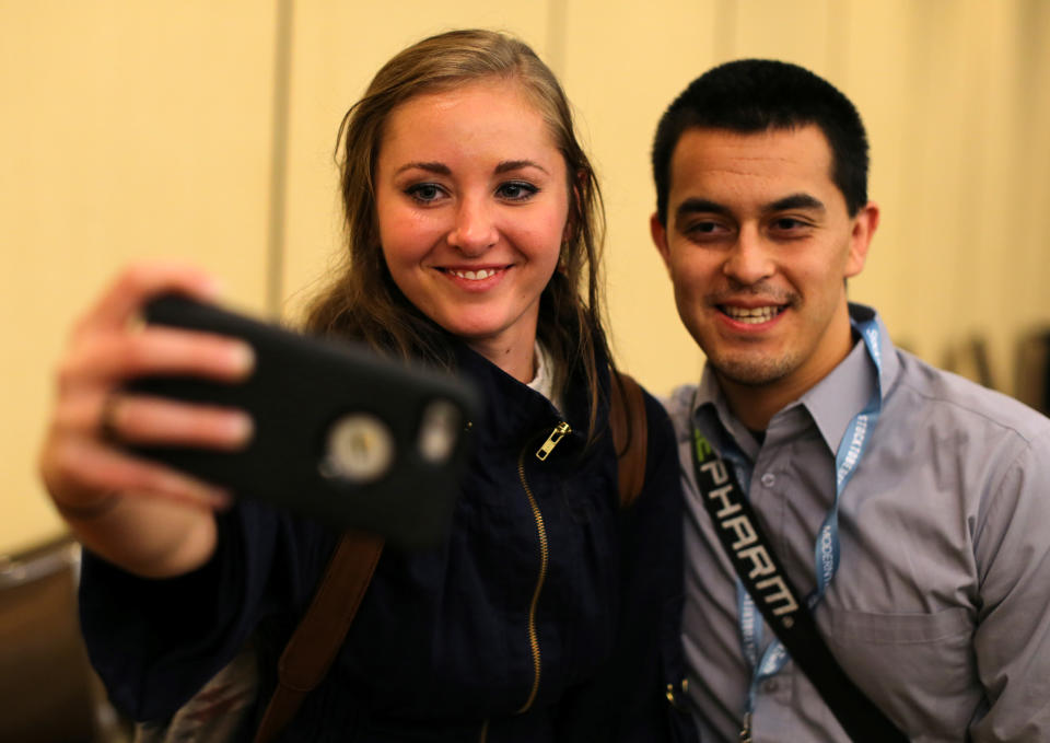 Millennial stock blogger and trader Rachel Fox, 20, is asked to take a picture with a fan after speaking to a group of investors, tech nerds and stock traders at StockTwits annual Stocktoberfest in Coronado, California, U.S. October 14, 2016. Picture taken October 14, 2016.    REUTERS/Mike Blake