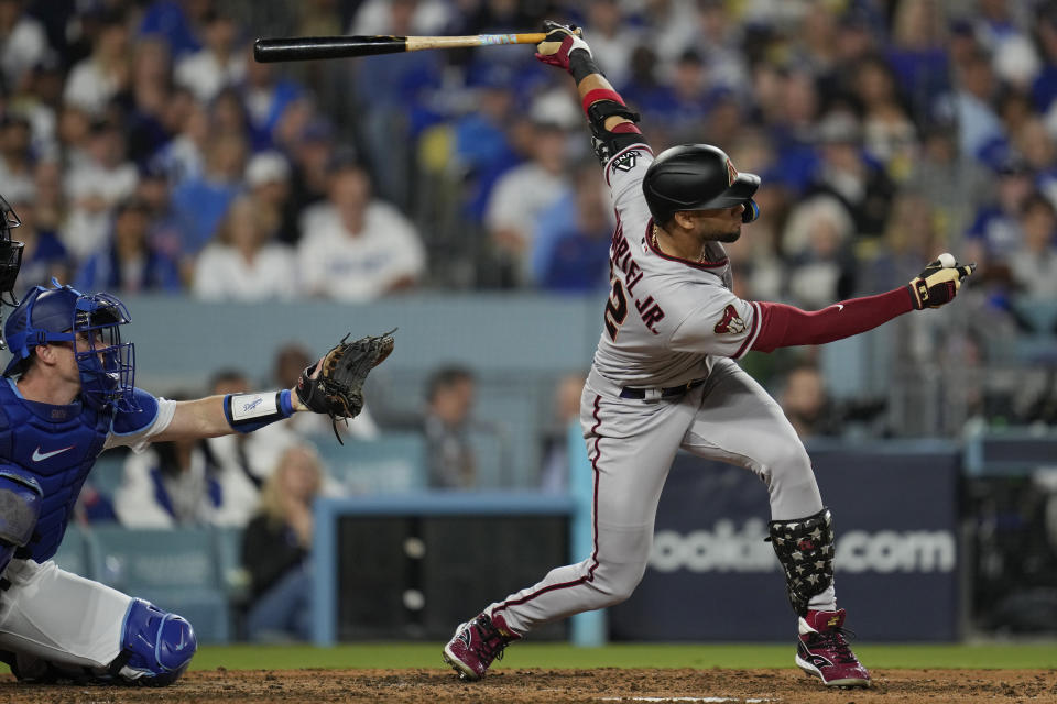 Arizona Diamondbacks' Lourdes Gurriel Jr. hits a solo home run during the sixth inning in Game 2 of a baseball NL Division Series against the Los Angeles Dodgers, Monday, Oct. 9, 2023, in Los Angeles. (AP Photo/Ashley Landis)