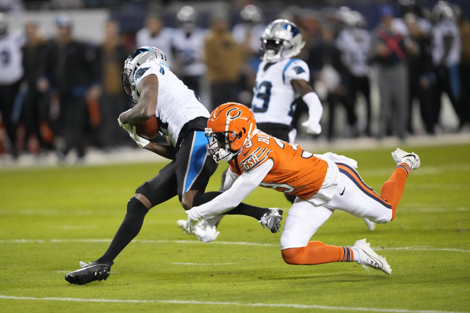 Carolina Panthers wide receiver Ihmir Smith-Marsette (11) evades the tackle from Chicago Bears cornerback Josh Blackwell (39) and returns a punt for a touchdown during the first half of an NFL football game Thursday, Nov. 9, 2023, in Chicago. (AP Photo/Charles Rex Arbogast)