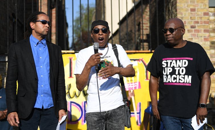 <span class="caption">Protestors gather in Brixton, London, where many Windrush arrivals settled.</span> <span class="attribution"><span class="source">EPA/Andy Rain</span></span>