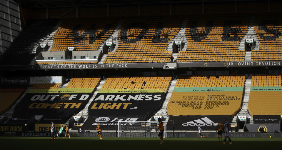 View of the empty stands during the English Premier League soccer match between Wolverhampton Wanderers and West Bromwich Albion at the Molineux Stadium in Wolverhampton, England, Saturday, Jan. 16, 2021. (Carl Recine/Pool via AP)