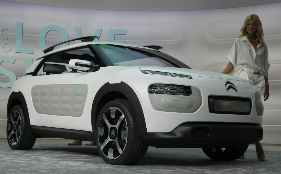 A model stands at Citroen Cactus concept car during a media preview day at the Frankfurt Motor Show